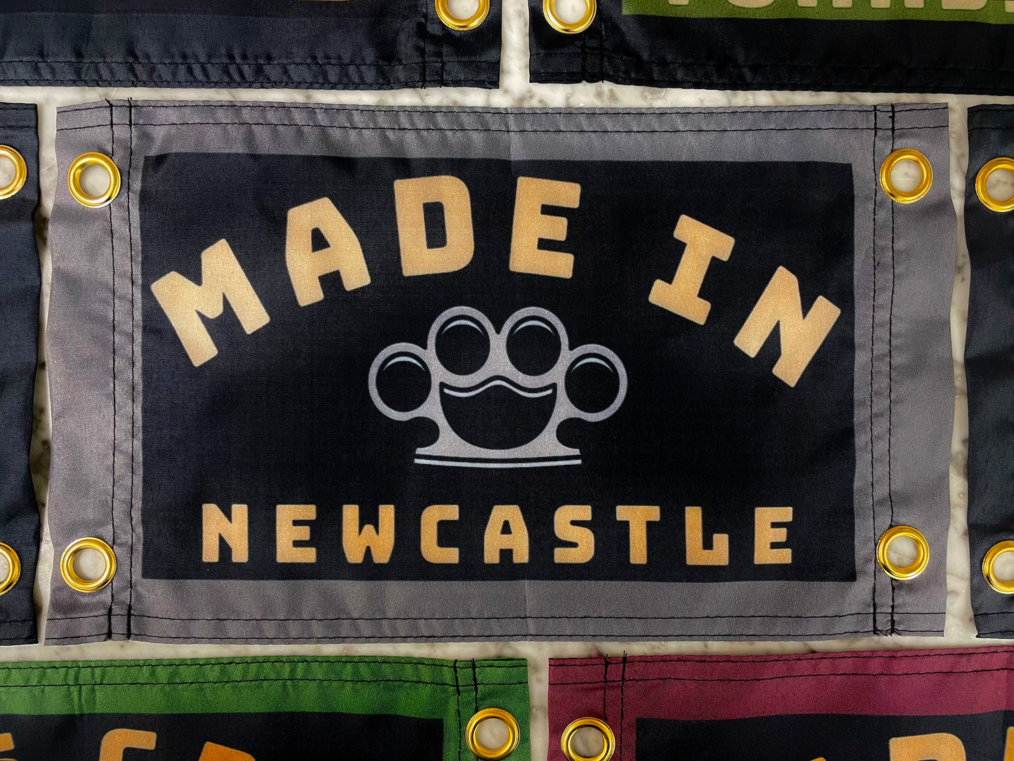 'MADE NEWCASTLE - KNUCKLEDUSTER' Mini Flag Pennant